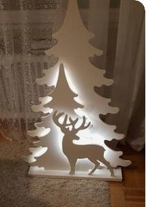 Deer with trees lit